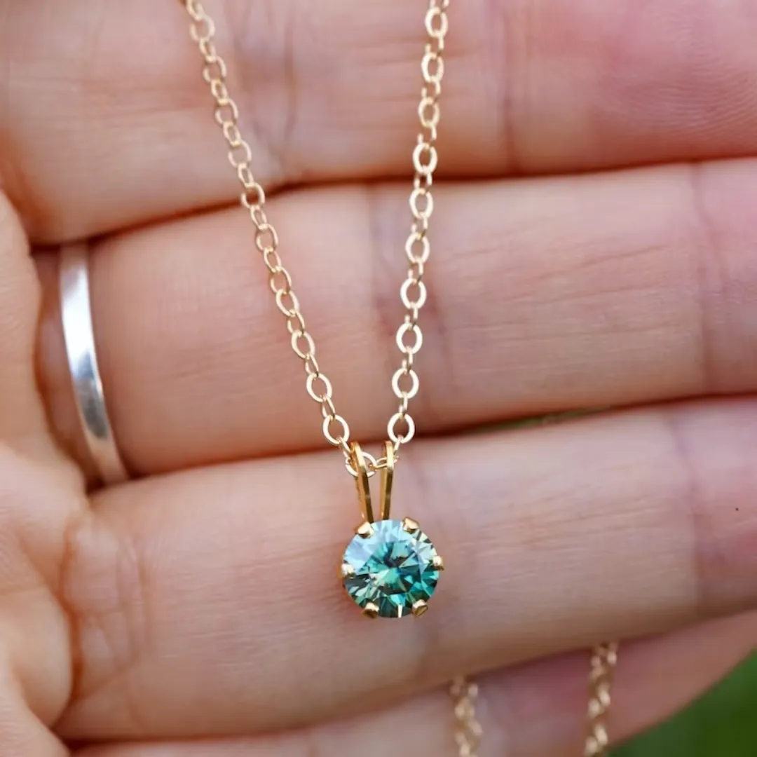 /public/photos/live/Delicate Round Cut Dark Green Moissanite Pendant   767 (2).webp